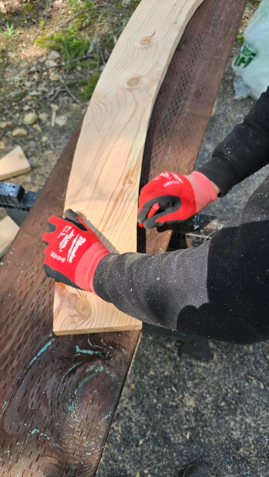 Varanelli Construction tracing the curved radius for a custom round sauna component in the Applegate Valley