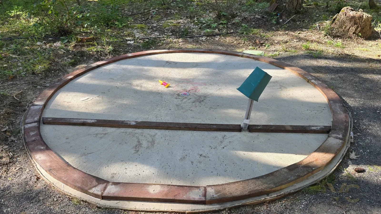 Circular bottom plate laid out on the sauna slab in the Applegate Valley before wall framing