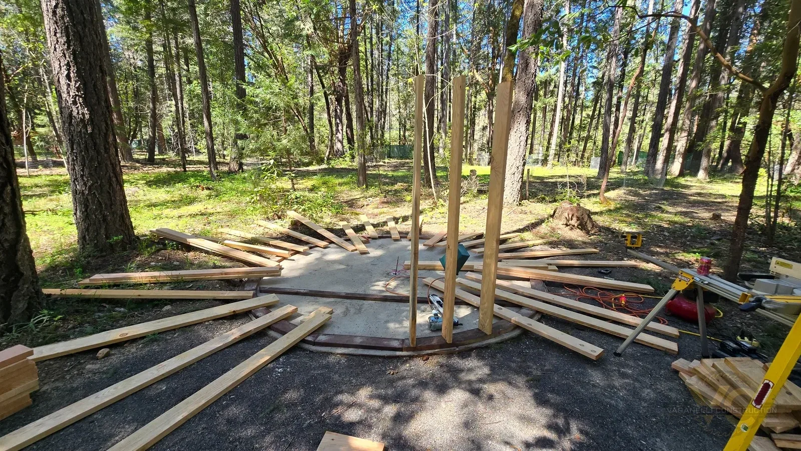 Round sauna wall studs being laid out around the circular slab in the Applegate Valley