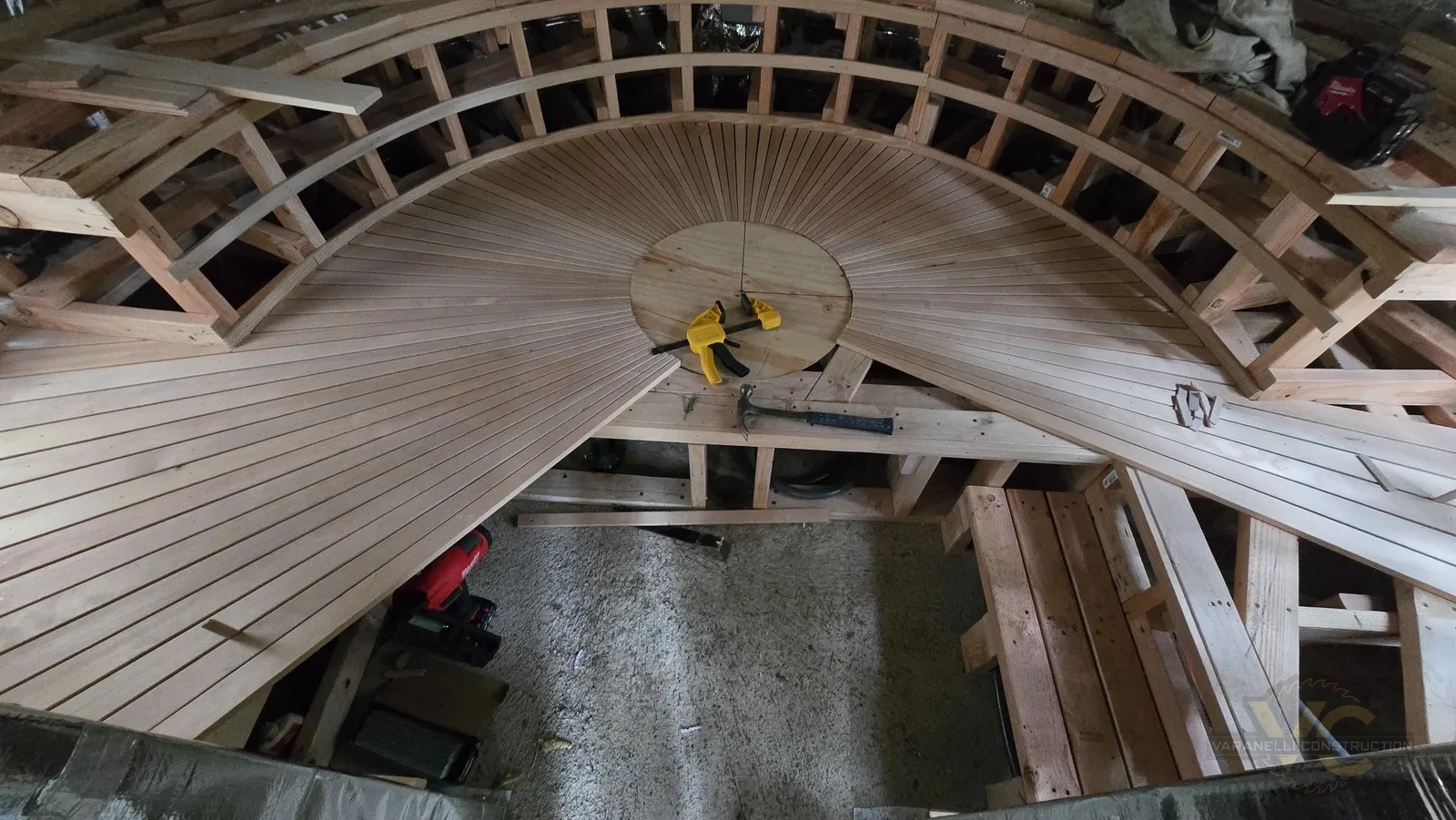 Radial framing layout for the custom sauna floor and bench arranged around the center point