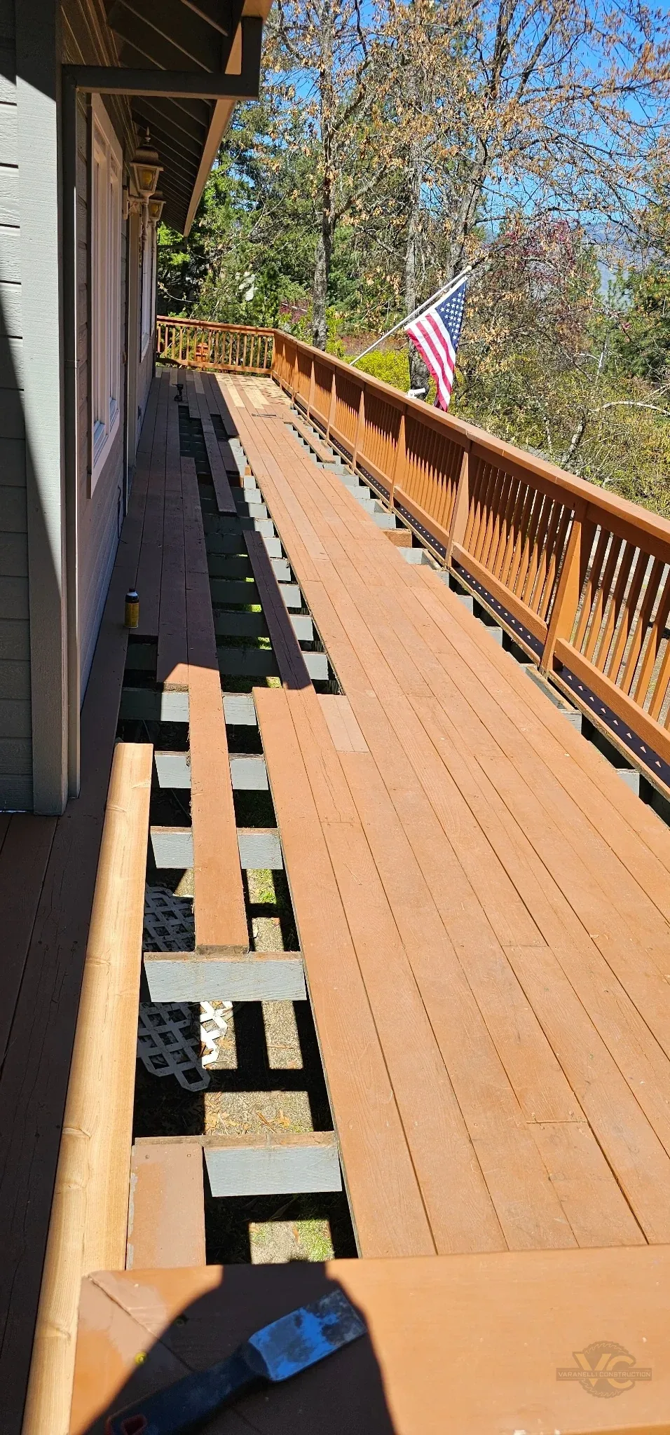 Cedar deck boards being selectively replaced during an Ashland deck repair project