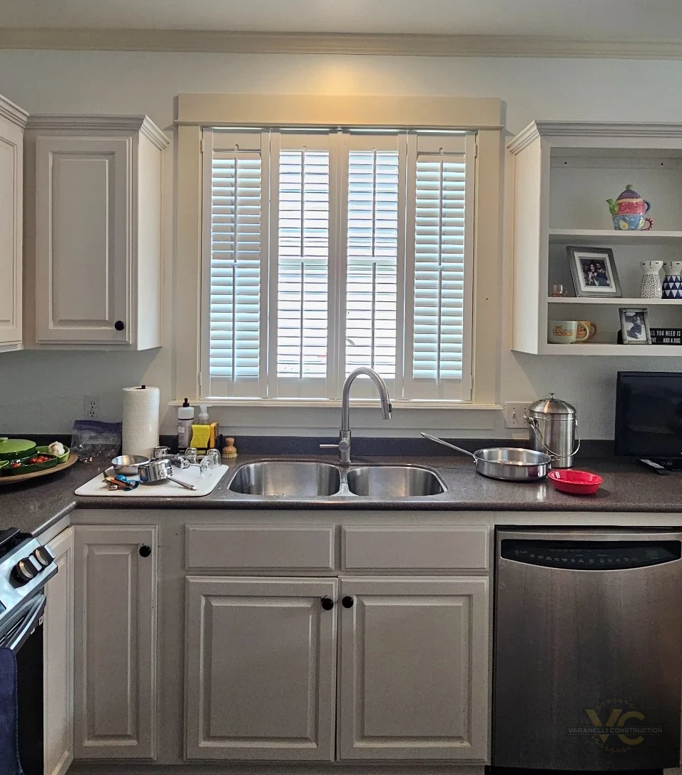 Ashland kitchen before remodeling showing the original sink wall, tall cabinetry and high countertop