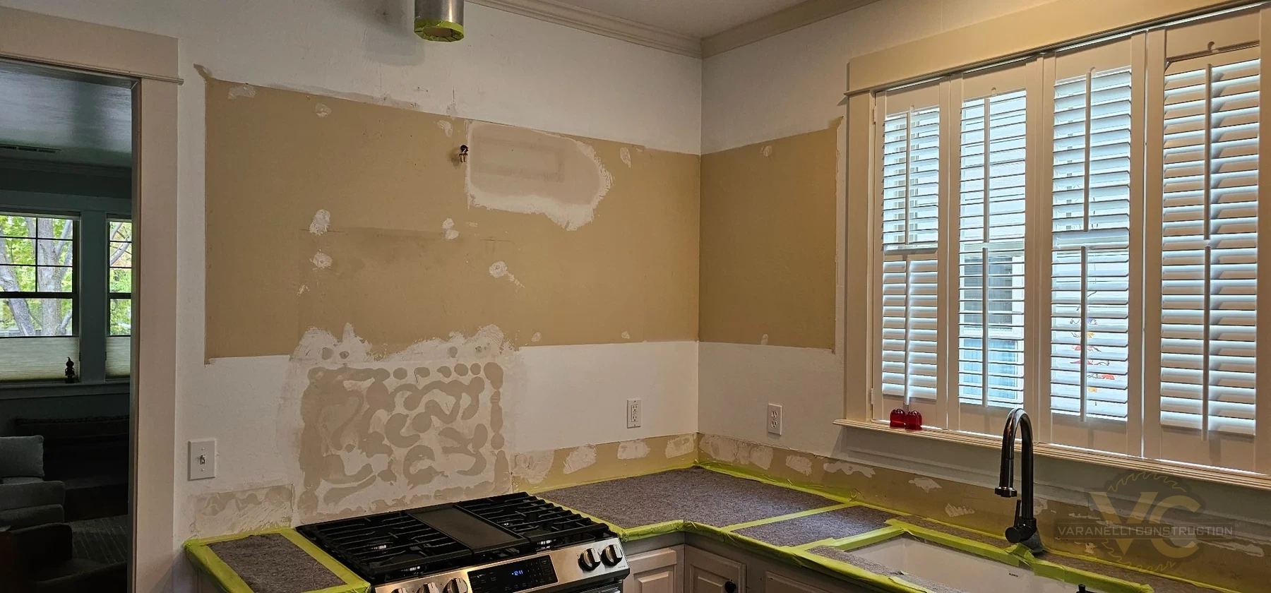 Ashland kitchen remodel in progress after upper cabinets were removed with lowered counter areas prepared for new finishes