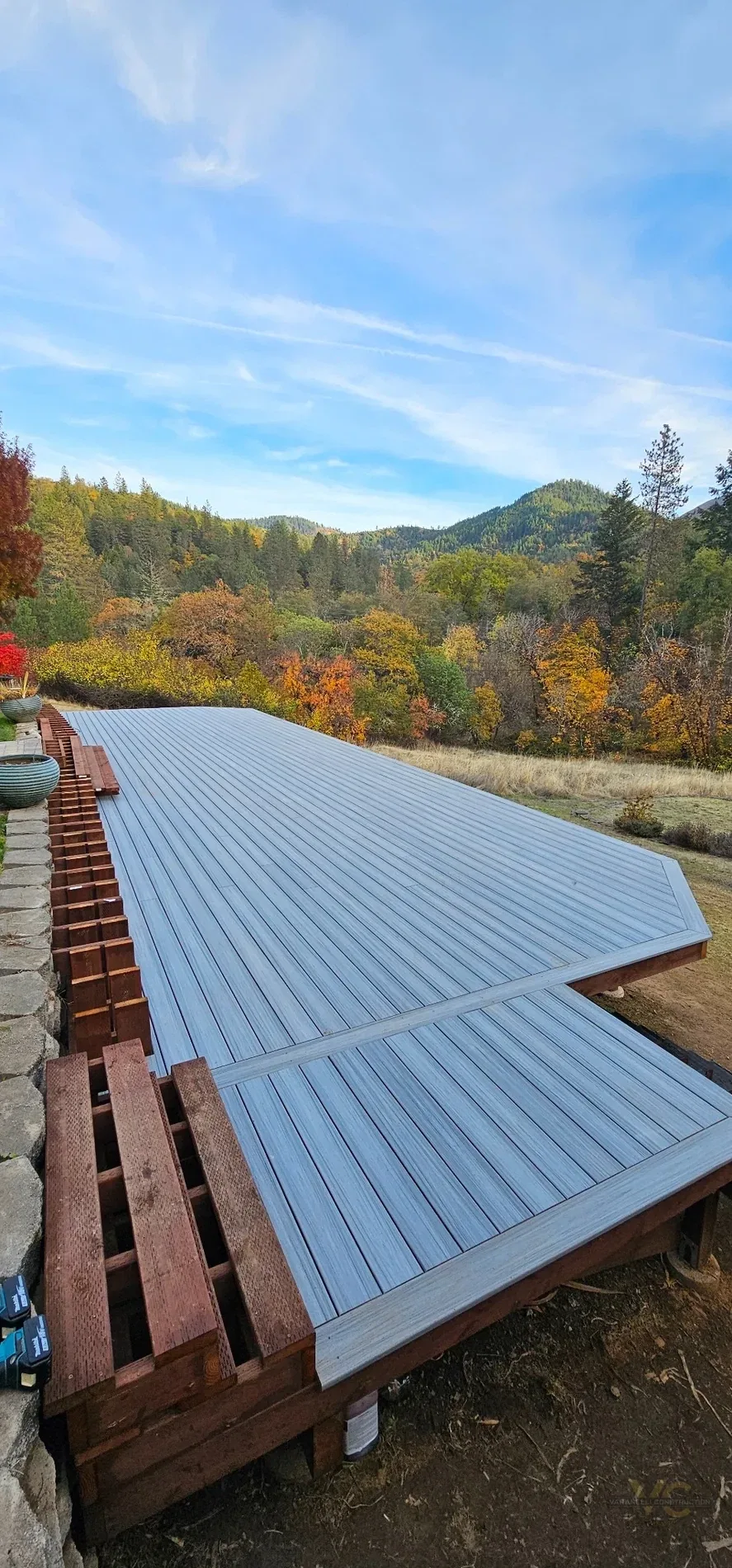 Large Trex deck surface overlooking the hills near Gold Hill, Oregon during construction