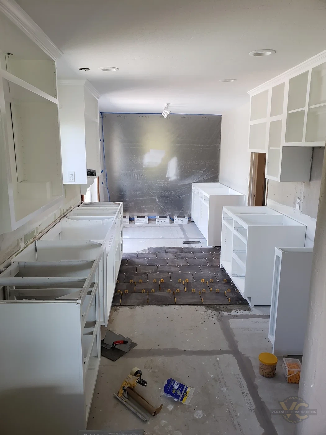 Grants Pass kitchen cabinet installation and tile floor progress by Varanelli Construction