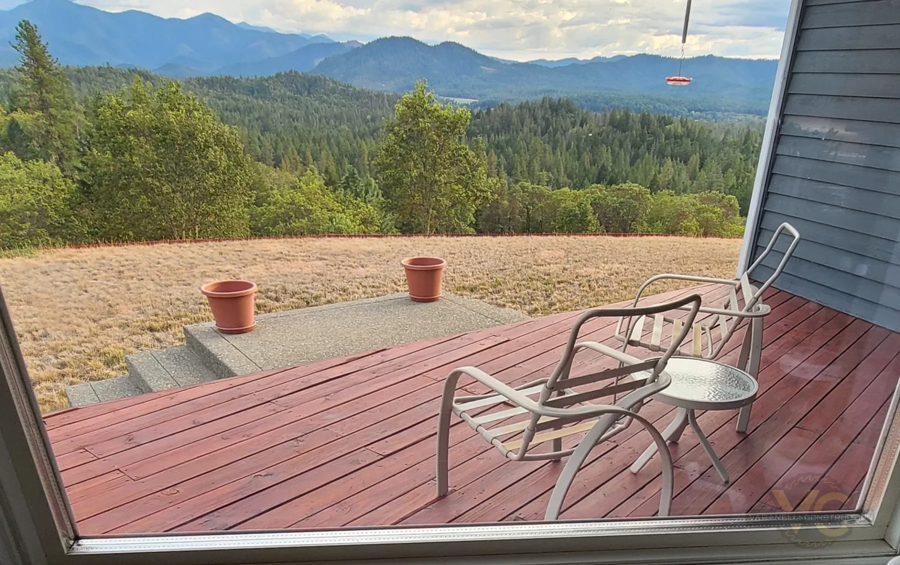 Worn existing cedar deck overlooking mountains before replacement in Grants Pass, Oregon