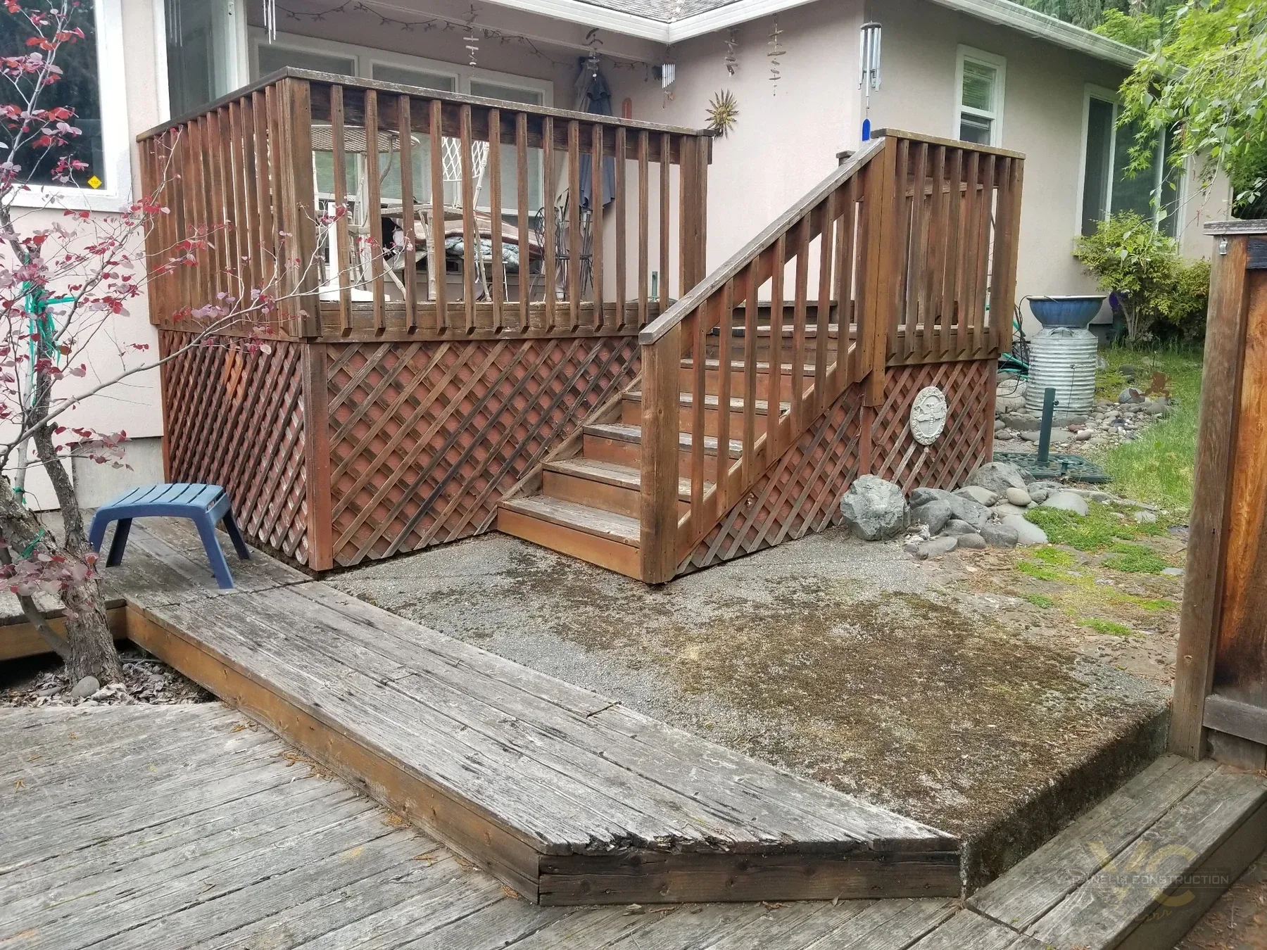 Old deteriorated split-level wood deck before replacement in Medford, Oregon
