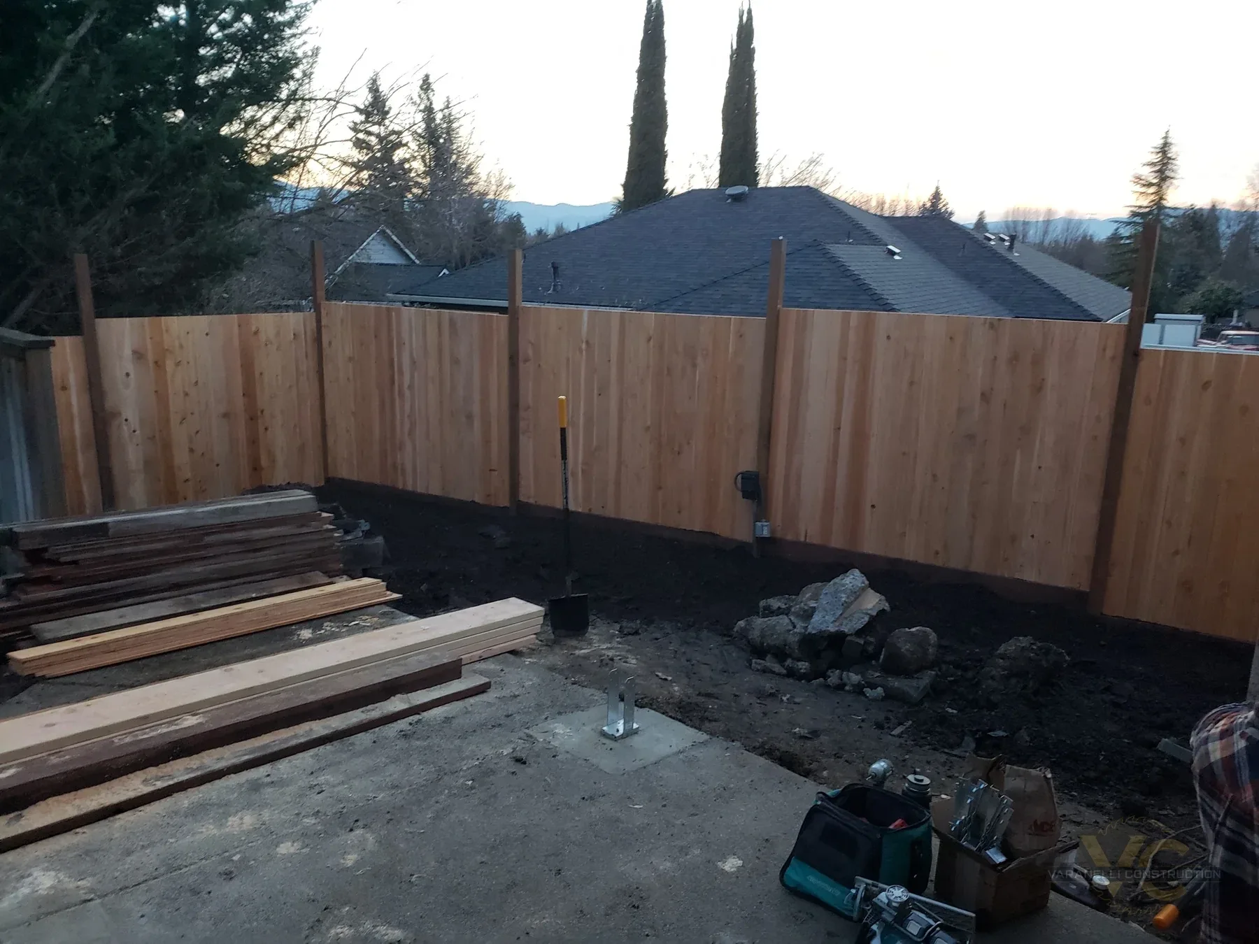 New cedar privacy fence installed during a Medford deck and fence project