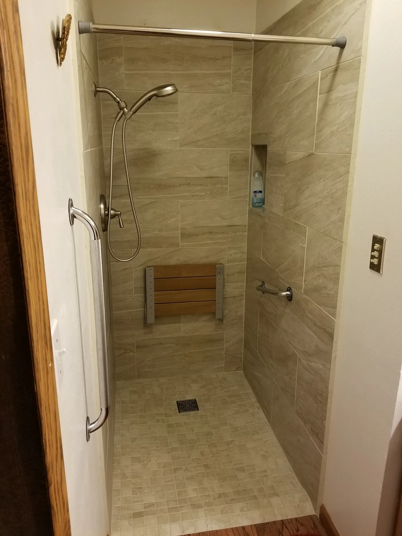 Tiled walk-in shower by Varanelli Construction