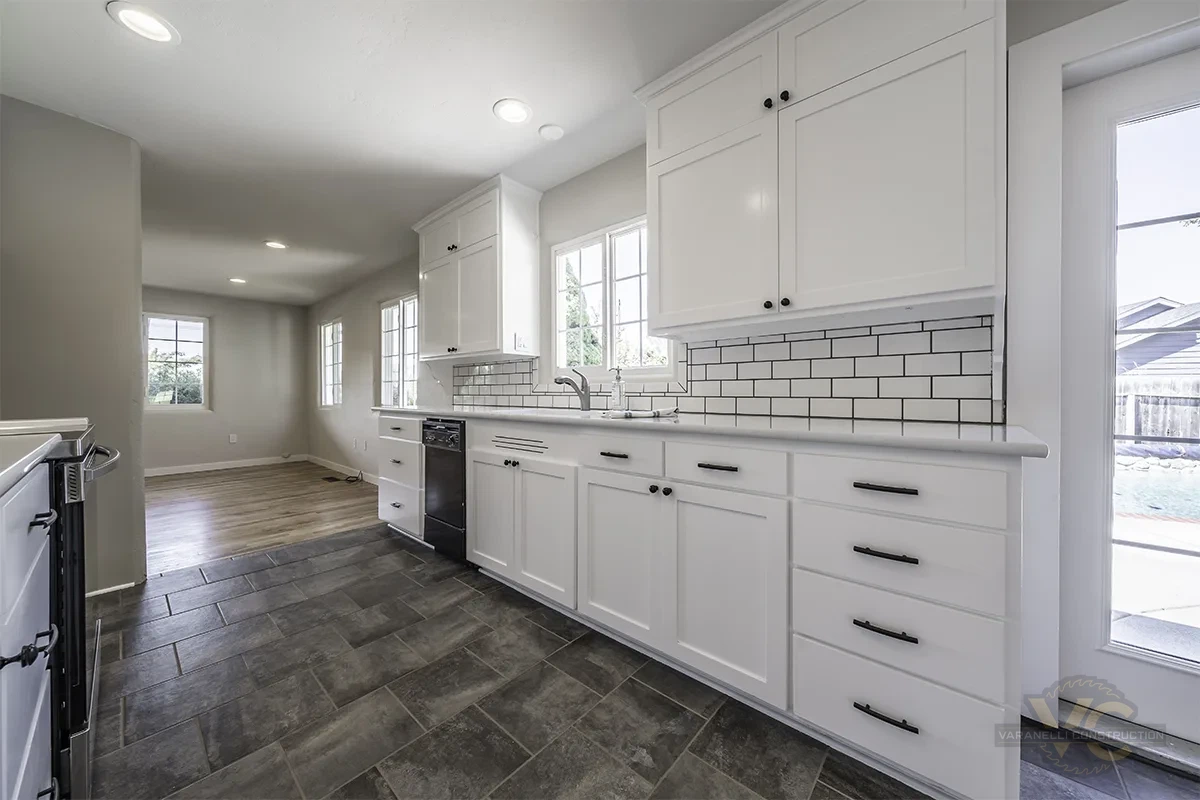 White kitchen cabinetry and counters by Varanelli Construction