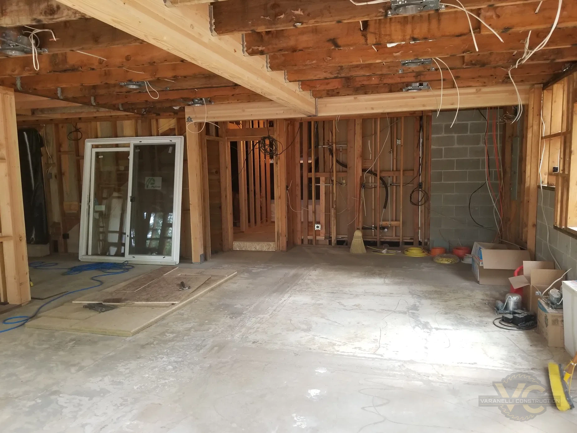 Interior structural remodel where walls were replaced with beams by Varanelli Construction