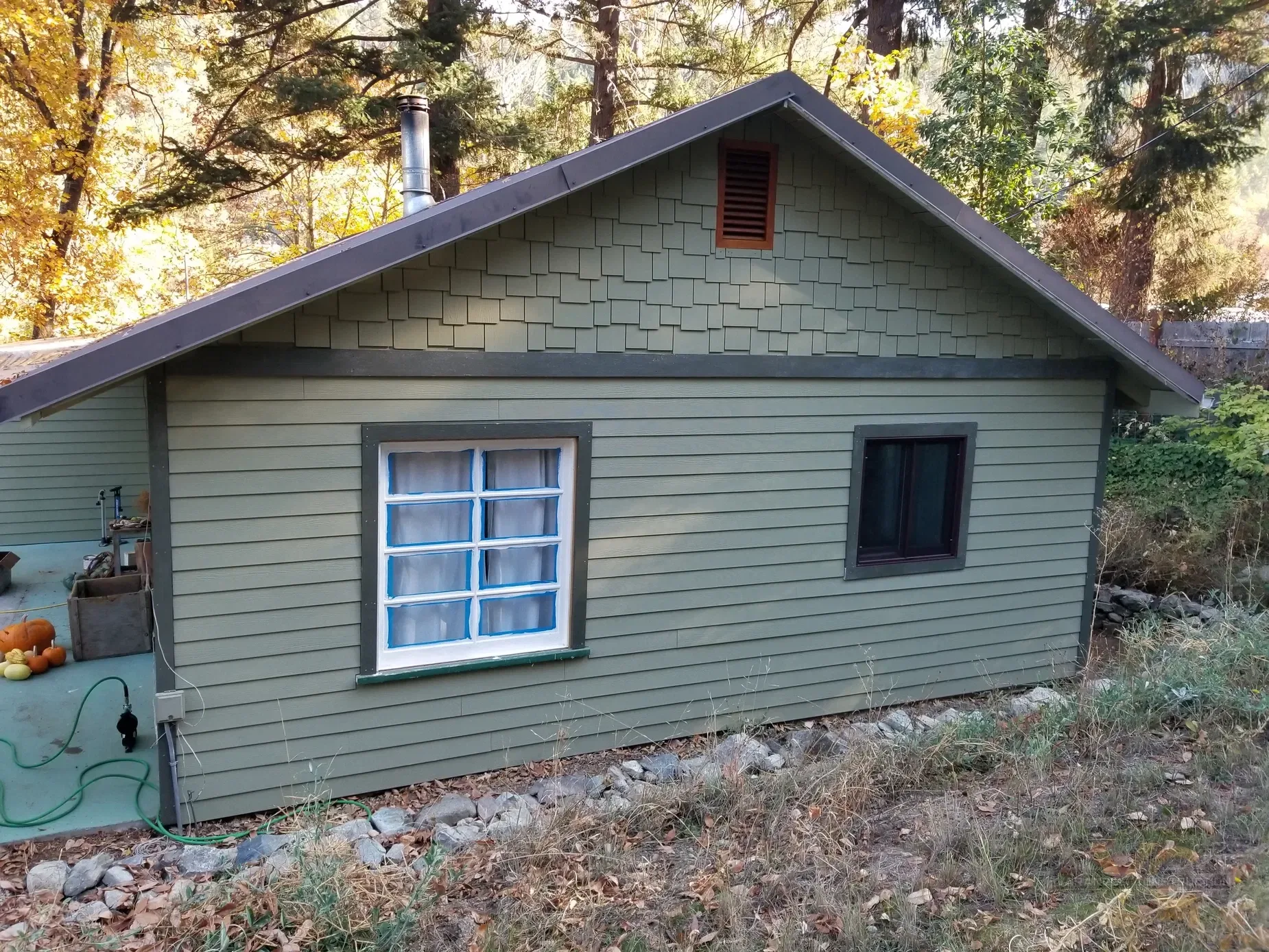 Cement fiber board siding installation on a green house by Varanelli Construction