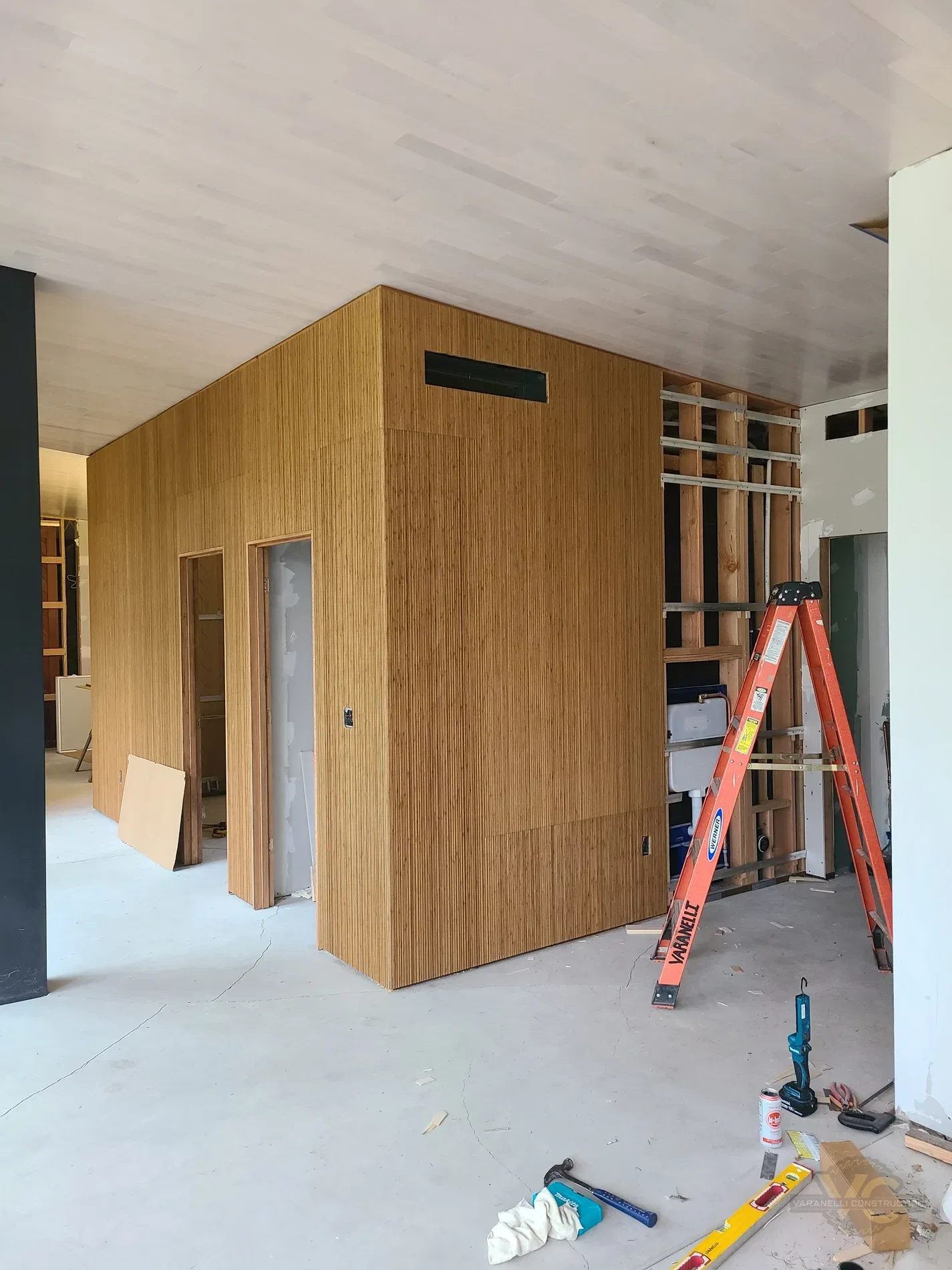 Custom wood interior buildout in progress by Varanelli Construction